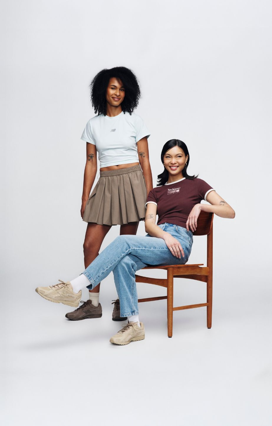Two people wearing 204 sneakers